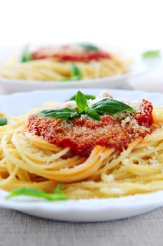 Pasta with tomato sauce basil and grated parmesan