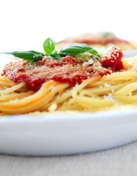 Pasta with tomato sauce basil and grated parmesan