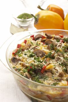 delicious risotto in glass bowl with paprika background 