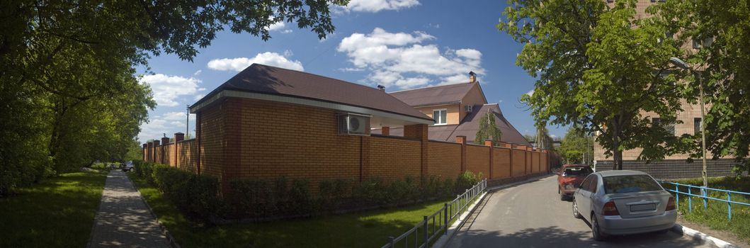 panorama of brick home. clear day