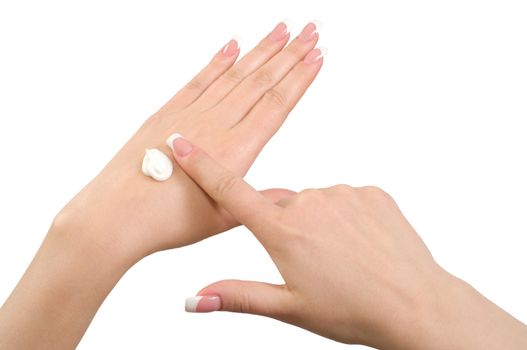 Application of hand cream isolated on white background.