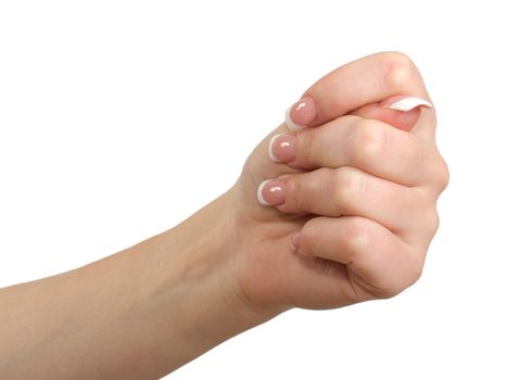 Woman's hand in close-up shows fig isolated on a white background.