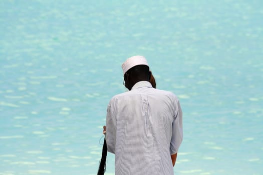 A shell necklace seller on the beach in Nungwi, Zanzibar