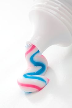 Stripey red, white and blue toothpaste.  Closeup