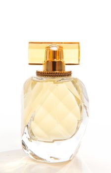 A bottle of beautiful women's perfume fragrance against a white backdrop.  