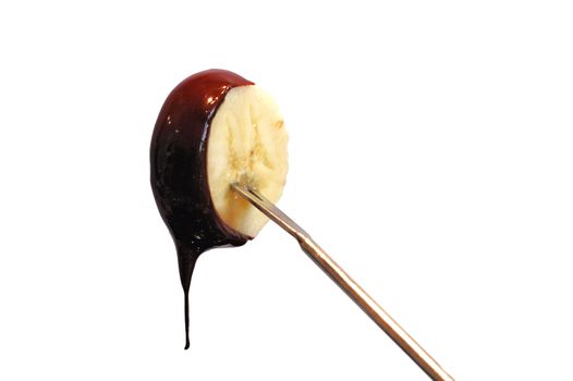 chocolate covered food on fondue stick