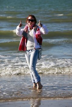 Happy beautiful girl on the beach