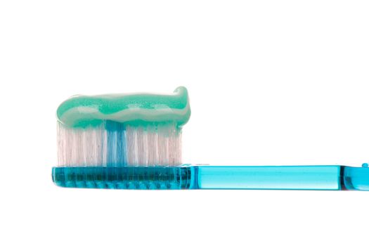Semi transparent blue toothbrush with a sparkly mint stripe toothpaste.  White background.