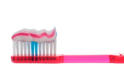 Semi transparent plastic toothbrush with striped toothpaste.