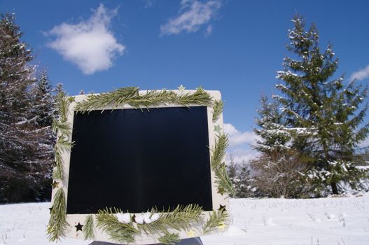 a decorated screen in snowy winter landscape