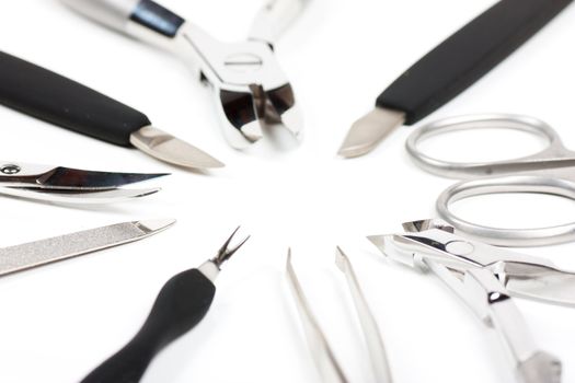 A set of metallic manicure tools.