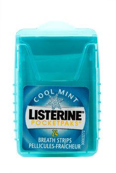 Listerine Cool Mint breath strips in a pocket pack.  Listerine oral care strips help kill the germs that cause bad breath in less than 2 minutes. Made by Johnson & Johnson.   White background.  