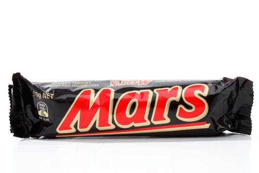 Mars bar, soft nougat, caramel and chocolate coated snack bar.  Manufactured by Mars Inc.  53g   1050kj  White background.  Editorial Use Only.