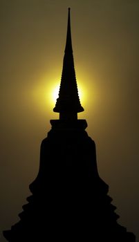 Sunset at the Wat Mahathat temple in the historical park of Sukhothai