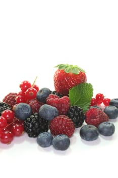 many different berries on a white background