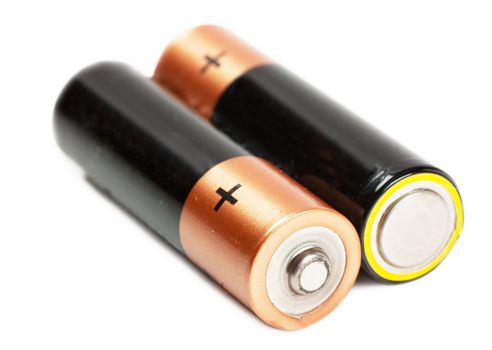 Two batteries isolated over white background