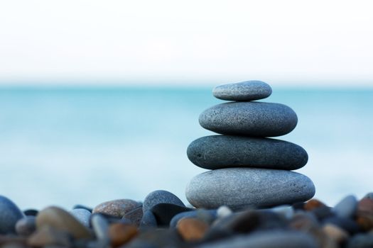 Stack of round smooth stones on a seashore