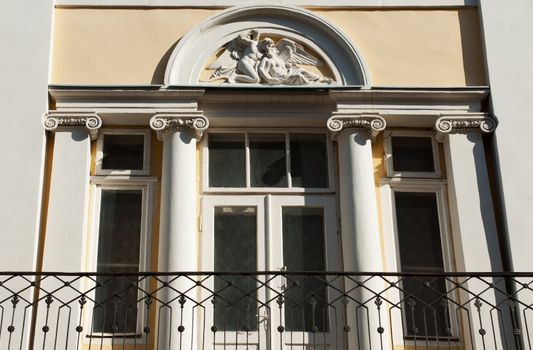 Facade of a building with a balcony. The building is constructed 1850-1890