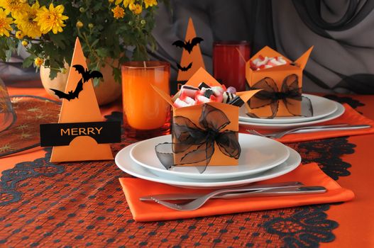 Festive table decoration for Halloween with candy in a box