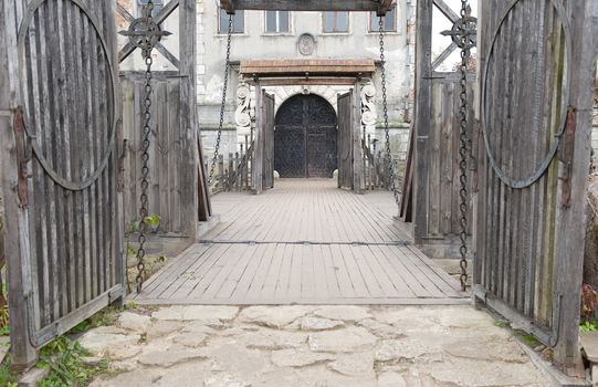 Input and suspension bridge in old castle. Lvov, Ukraine