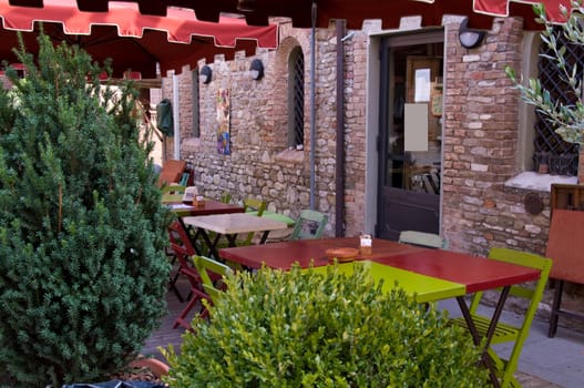 Empty bar with chairs and tables, in Castelvetro