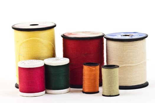 mixed colors and sizes of thread used to sew