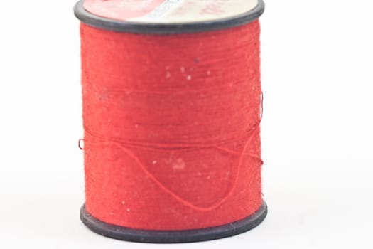 A single bolt of thread red.
