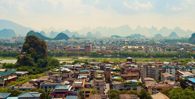 Guilin city view with mountains in background, China