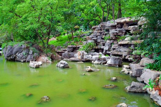 Green Japanese pond with green water