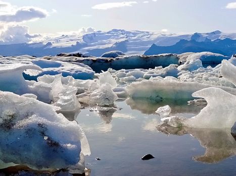 light blue ice melting landscape during summer in Iceland