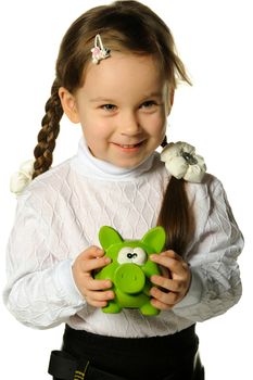 The little girl with a money box - a pig. It is isolated on a white background