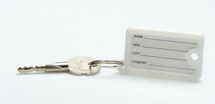 Key with  trinket . In trinket  a white paper label for records