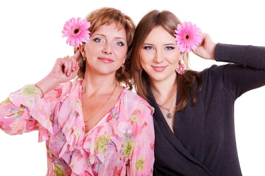portrait of mother and adult daughter isolated on white