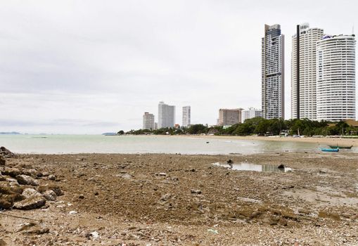 Beach, rocks, and hotels. The sea east of Thailand.