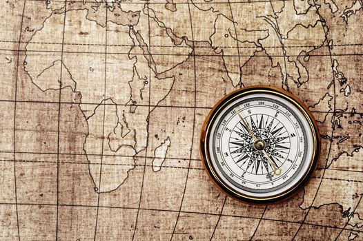 Compass on old map. Brown tone color