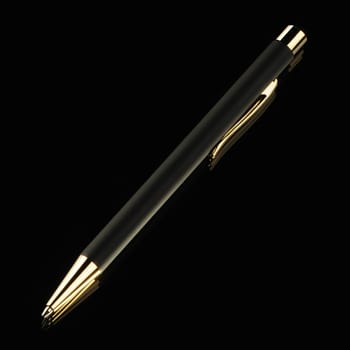 Black pen on a black background. Yellow metal