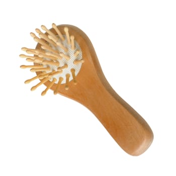 Wooden hairbrush. It is isolated on a white background