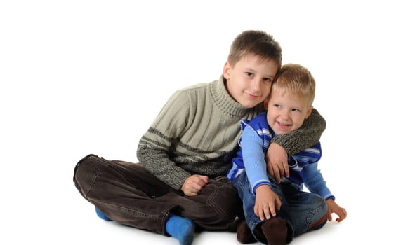 Two brothers. Age of 3 and 7 years. It is isolated on a white background