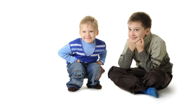 Two brothers. Age of 3 and 7 years. It is isolated on a white background