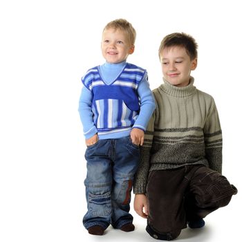 Two brothers. Age of 3 and 7 years. It is isolated on a white background