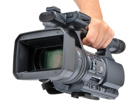 Videocamera in a hand. It is isolated on a white background