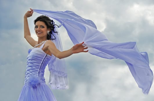 The bride with a fluttering veil. The young girl in a wedding dress.
