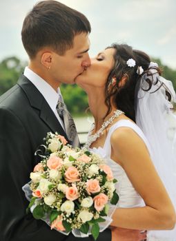 Newly-married couple. Pair young men in wedding day