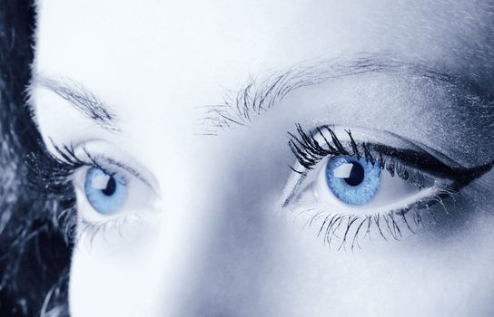 Female blue eyes. A photo close up, a part face