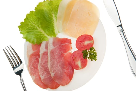 Meat cutting with vegetables and cheese. It is isolated on a white background