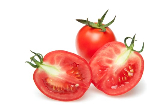 The cut tomatoes. It is isolated on a white background
