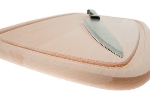 Knife and board for cutting food. Studio shooting.