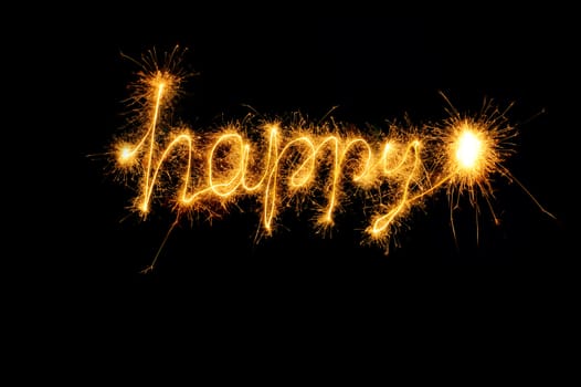 Inscription Happy from sparks. It is isolated on a black background