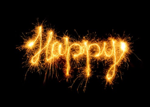 Inscription Happy from sparks. It is isolated on a black background