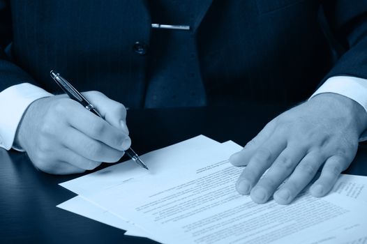 The businessman the signing contract. Blue color.